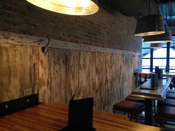 American Prairie Faux Painted paneling wraps around the lower half of this restaurant seating area. American Prairie paneling wraps around the lower half of this restaurant seating area.