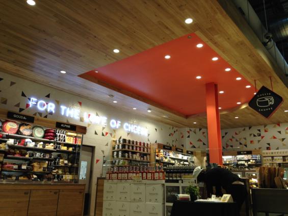American Gothic Ash reclaimed wood paneling is used on the ceiling of the cheese shop in Whole Foods Lakeview