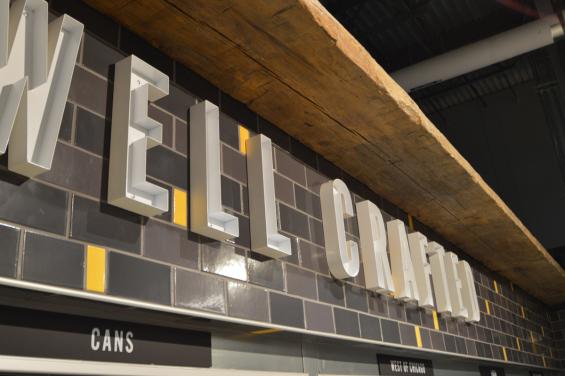 Reclaimed agricultural timber used as an accent piece inside Whole Foods Lakeview