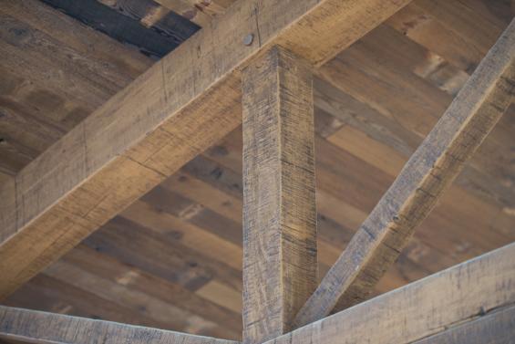 Close up of custom finished timber from our sister company, New Energy Works, and reclaimed mushroom board ceiling