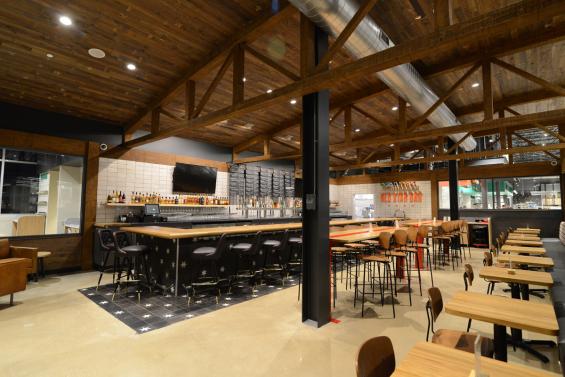 Timber trusses from our sister company, New Energy Works, and reclaimed mushroom board used in the Red Star Bar within Whole Foods Lakeview