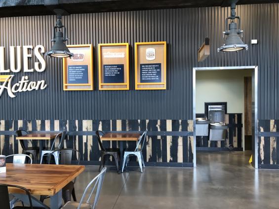 Black and Tan 50/50 Mixed Oak is used as wainscoting around the eating area of this Whole Foods Market
