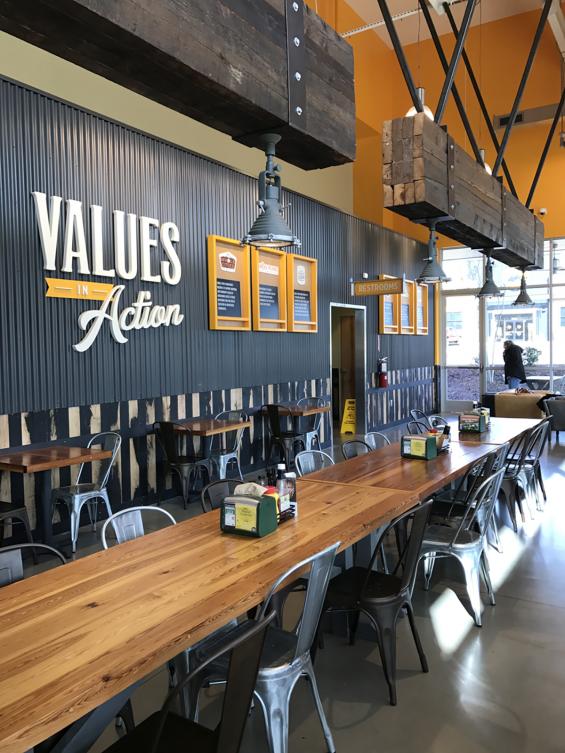 Large industrial looking lighting fixtures were created by banding together 3'x6' beams with metal strapping