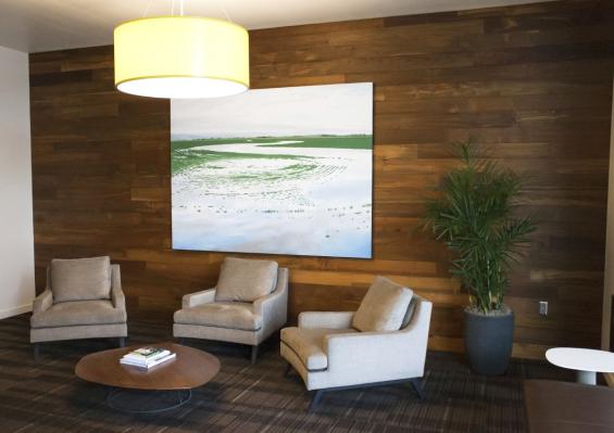 Reclaimed Teak paneling welcomes tenants and visitors at the main lobby entry of Block 37. A street level seating area thoughtfully invites folks to sit and chat.