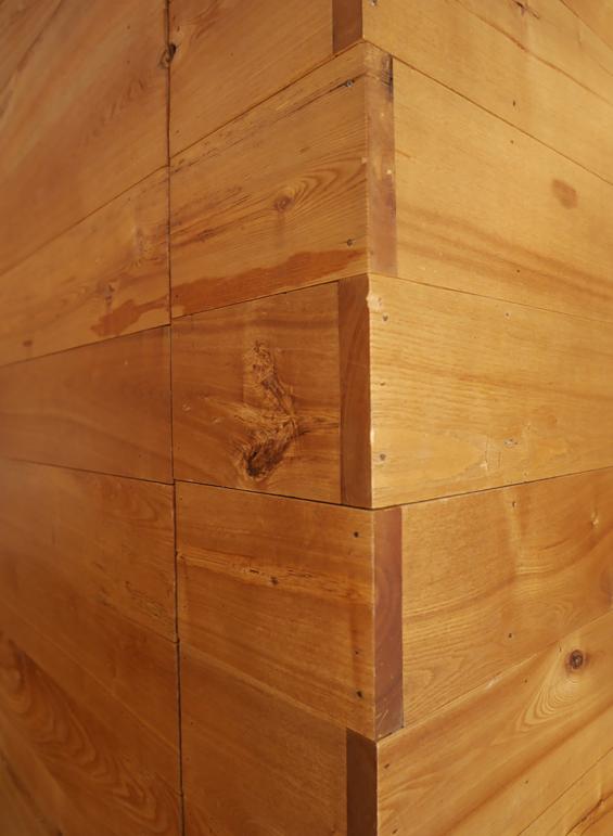 Overlapping corner joints created from American Gothic Ash reclaimed wood paneling
