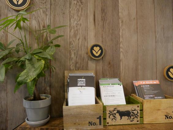 Mixed Softwoods Vat Stock Patina reclaimed from cherry vats is used as paneling throughout the Sandwicherie near Grand Central. 