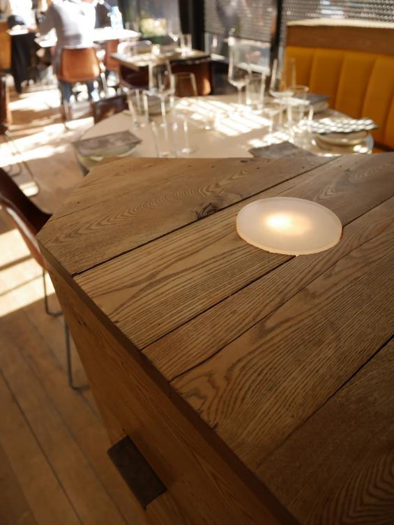 American Gothic Ash reclaimed wood wrapped around this corner booth seating area in Charlie Bird Restaurant