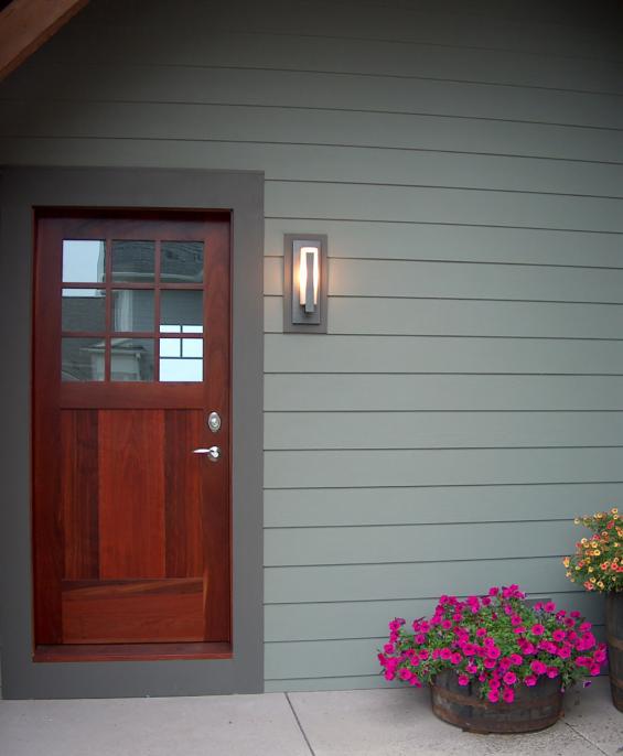 A side entry door crafted of reclaimed exotic hardwood, Jarrah (see Karri).