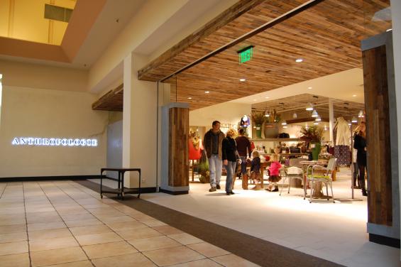 Reclaimed from pickle vats, narrow wood stock is shown here as the ceiling accent.