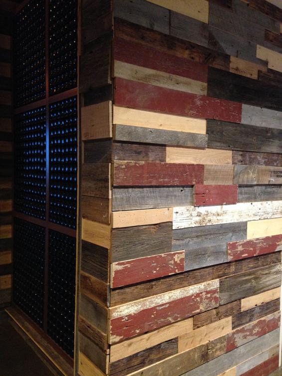 A mixture of various grades of reclaimed wood paneling in multiple thicknesses was used to achieve this look at the Brew Brothers restaurant in Columbus, OH