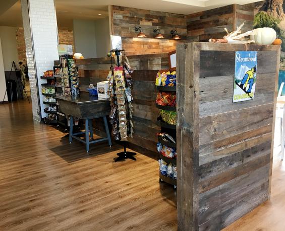 The half walls of this Colorado college cafe are comprised of the same American Prairie Taphouse reclaimed paneling .