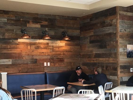 The walls of this Colorado college cafe are clad in American Prairie Taphouse reclaimed paneling.