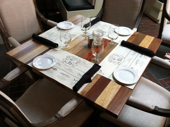 Reclaimed exotic hardwoods in a bright grade see plenty of seafood at this oceanside eatery.