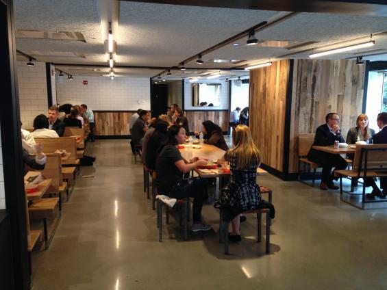 Settlers' Plank mixed hardwoods reclaimed wall paneling lines the walls up the upstairs eating areas in Dos Toros.