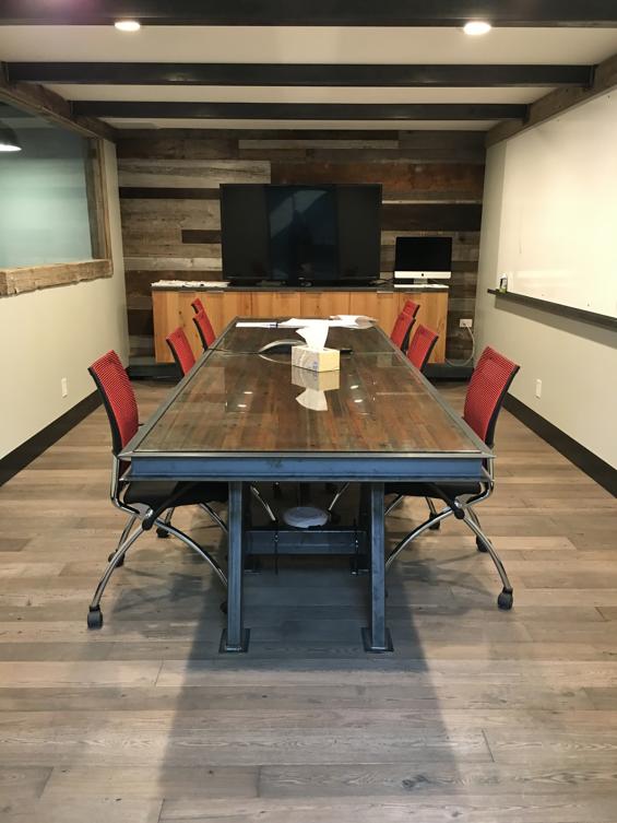 American prairie siding, grey ash, and bowling lanes all combine in this conference room.