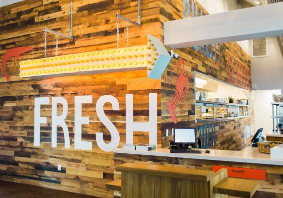 Settlers' Plank mixed hardwoods, finished with Monocoat, CNC etching, panel assembly, and painting by NEWwoodworks.