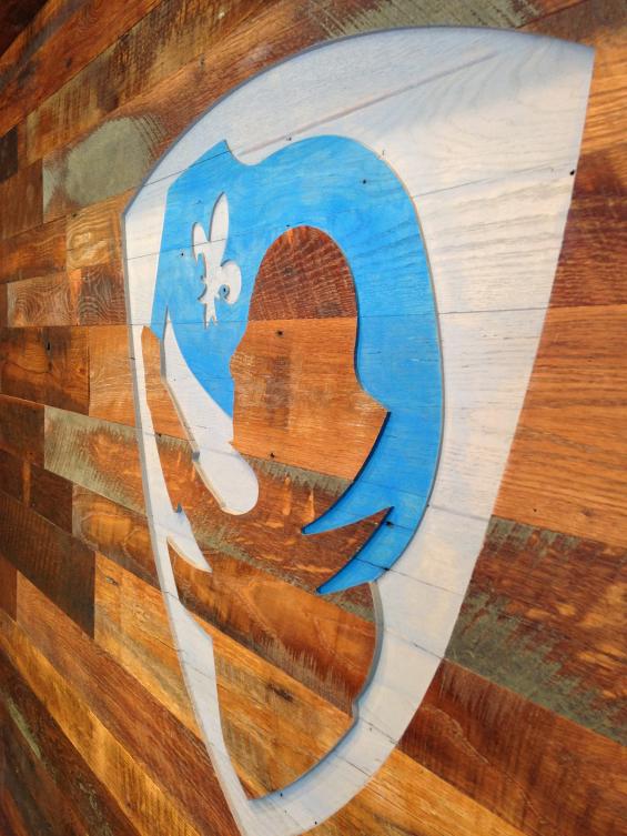 Settlers' Plank Mixed Oak wall paneling, cut with a CNC of the credit union's logo done by our sister company NEWwoodworks