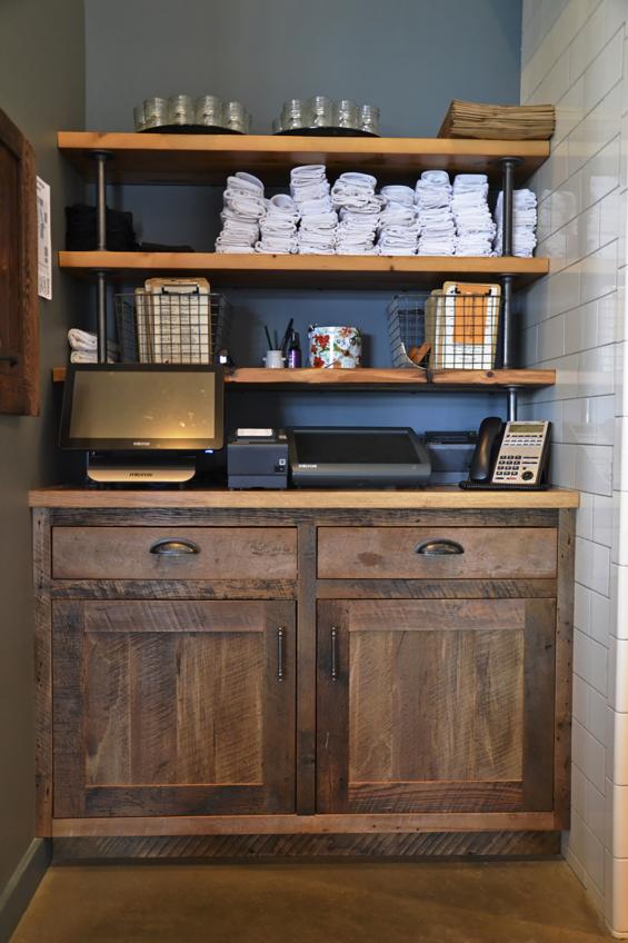 Settlers' Plank Mixed Hardwoods form the cashier station off the main dining area in Kindred Fare.