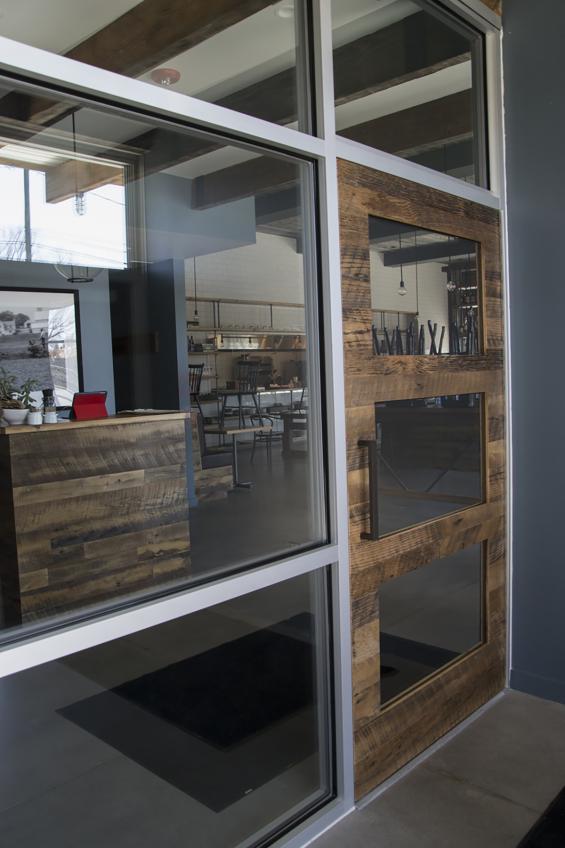 Using reclaimed mixed hardwood, NEWwoodworks crafted this torsion box entry door.