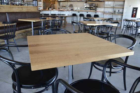 Sustainably Harvest Oak tops provide a crisp backdrop to the farm-to-table eats at Kindred Fare in New York.
