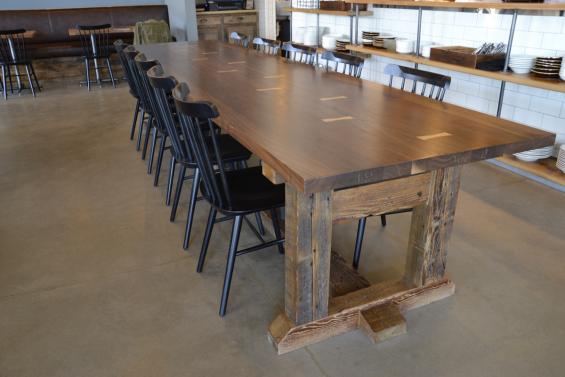 Walnut combines with reclaimed hemlock in a table suited for 12.