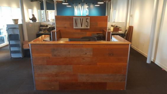 Reception desk created from reclaimed Bleacher Boards 