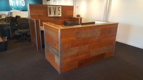 Reception desk created from reclaimed Bleacher Boards 