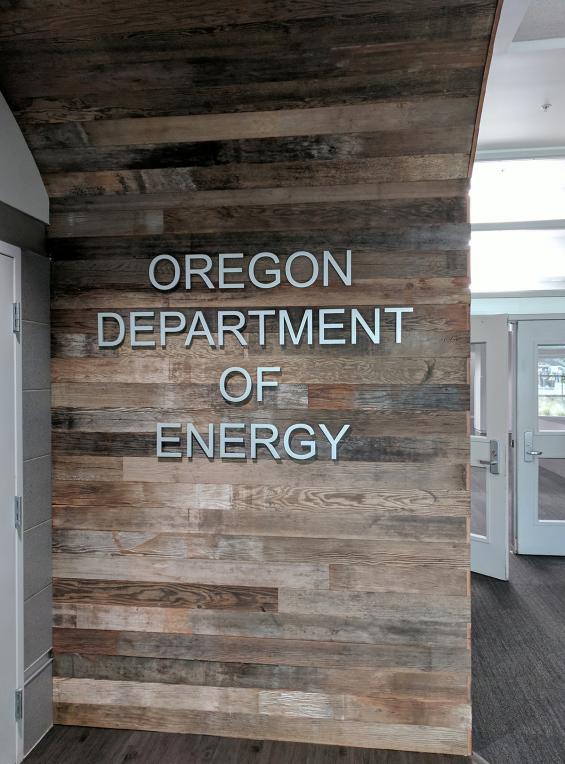 Entryway to the offices of the Oregon Department of Energy, framed by reclaimed Mixed Softwoods Vat Stock wall paneling. 