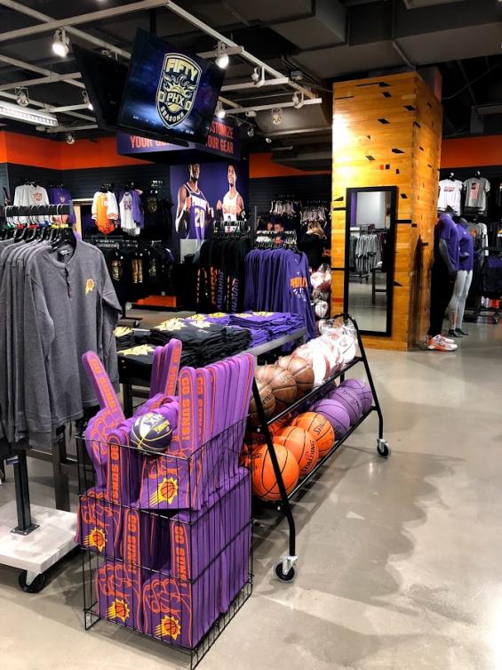 The commercial space of the Phoenix Suns team store in Arizona is enhanced by the use of original gym flooring.