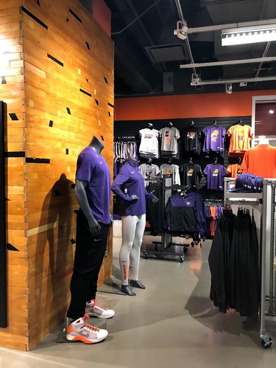 Original gym flooring is used as paneling on the pillars of the Phoenix Suns team store in Arizona.