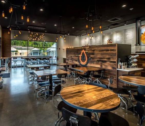 Panel, tables, and even the cashier fixture are crafted from Settlers' Plank in Pressed Cafe in New Hampshire.