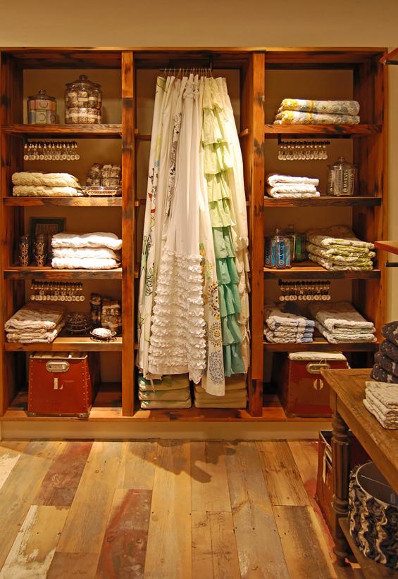 Custom built-in fixtures and shelving crafted of reclaimed vat stock by NEWwoodworks.