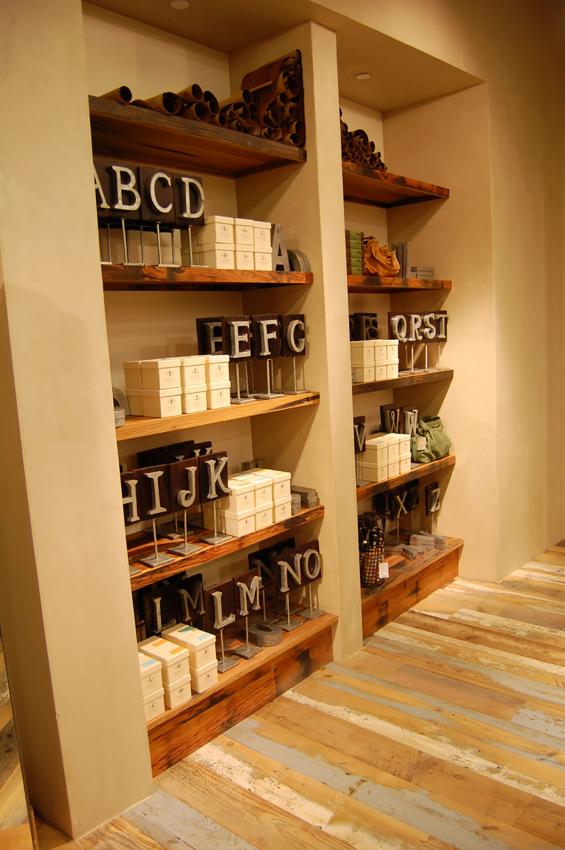 Custom built-in fixtures and shelving crafted of reclaimed vat stock by NEWwoodworks.