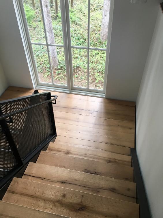 These stair treads were custom fabricated from American Gothic White Oak reclaimed wood