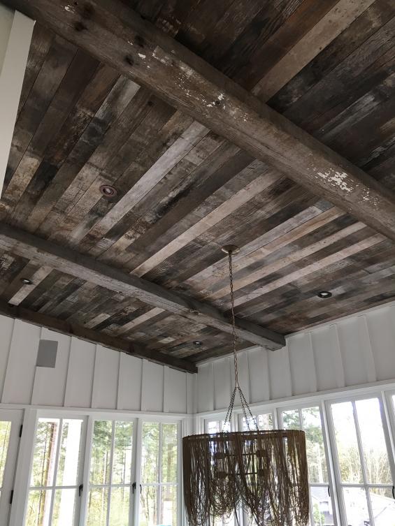Mixed Softwoods Vat Stock Patina reclaimed from cheery vats was used as ceiling paneling in this Portland home
