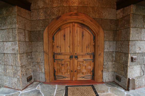 American Gothic Reclaimed Oak doors on a meditation center are both arched and curved.