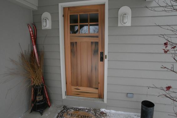 Natural staining and streaks hint to the history of the vat sock used to craft this residential door.