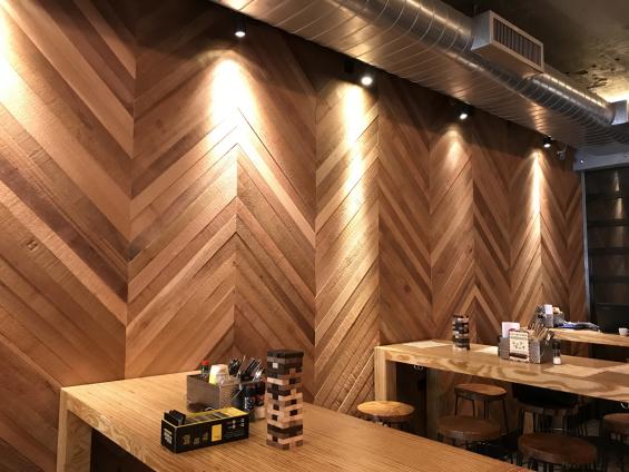 FSC-certified Western Red Cedar wall panelling arranged in a playful chevron pattern.