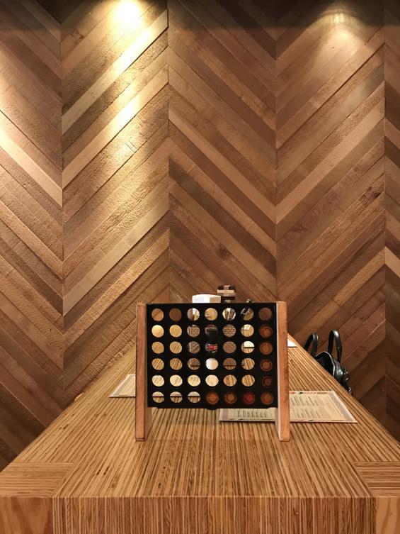 FSC-certified Western Red Cedar wall panelling arranged in a playful chevron pattern.