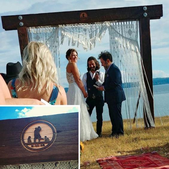 Wedding logo etched into reclaimed timber arbor. 
