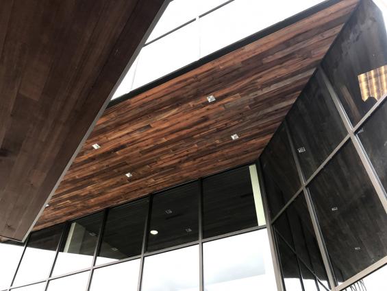 Reclaimed Indonesian Teak Bright ceiling paneling on the exterior overhang of a Federal Way, WA office building