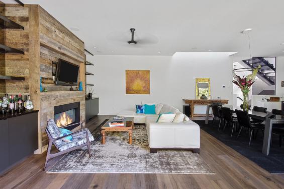 American Prairie Taphouse reclaimed wood used as interior wall paneling inside this Portland, OR living room. Photo by KLiK Concepts. 