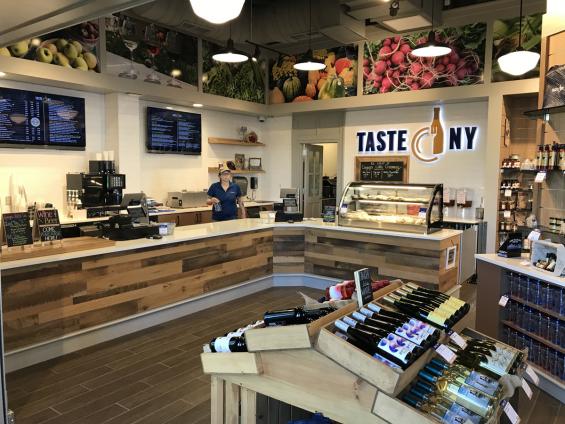 Settlers Plank mixed hardwoods paneling around the cash wrap.