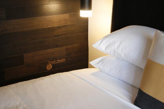 American Gothic Mixed Oak reclaimed wood wall paneling in the guest rooms of Hi-Lo Hotel in Portland, OR. 