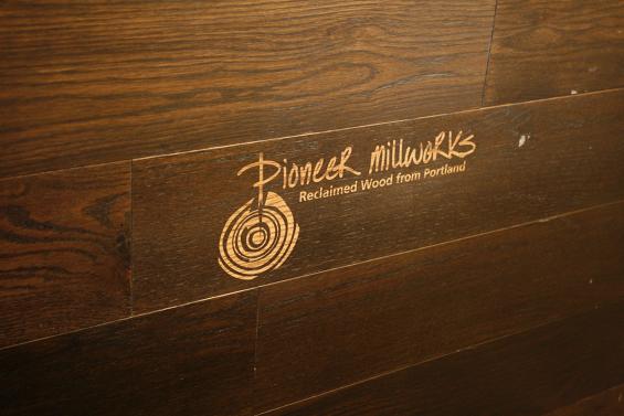 Pioneer Millworks logo was laser etched into the reclaimed wood in each of the guest rooms at Hi-Lo Hotel. 