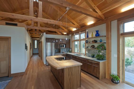Douglas fir c-select vertical grain flooring and American Gothic reclaimed wood kitchen cabinets. Photo by Loren Nelson. 