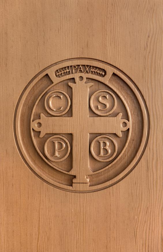 Douglas fir pedestals adorned with a laser engraved seal of the Mount Angel Abbey.