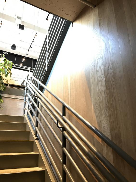 Sustainably Harvested White Oak paneling in the stairway.