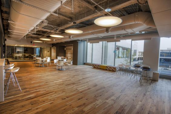 Pioneer Millworks American Gothic Hickory reclaimed wood flooring in an office space in Rochester, NY