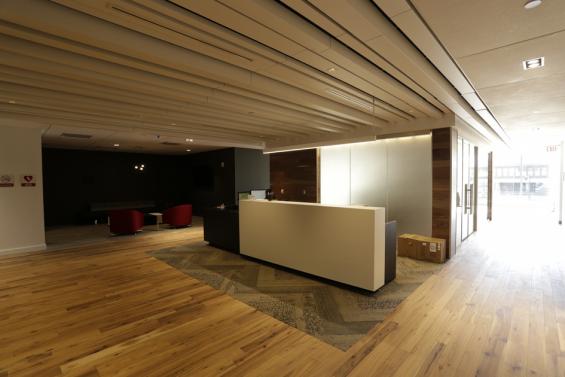 Pioneer Millworks American Gothic Hickory reclaimed wood flooring in an office space in Rochester, NY